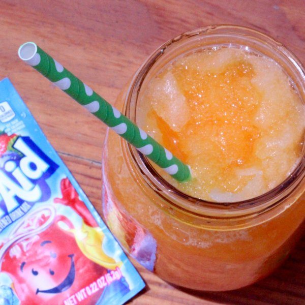 How to make a Slushie with Kool Aid mix. These kool-aid slushies are fun for kids in the summer. These Kool aid slushies are so easy to make. Once you learn how to make a slushie, the kids will be so excited! Find out how to make slushies and beat the heat!