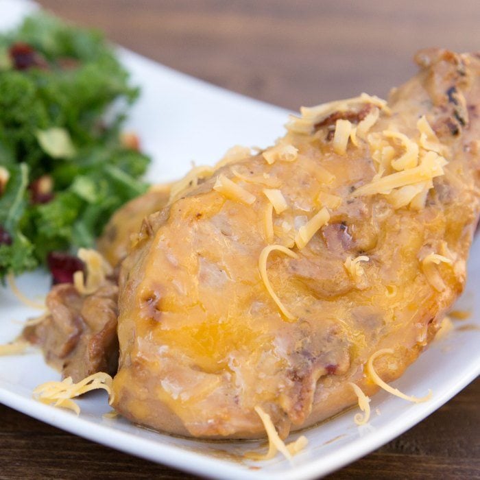 Try this easy Crock Pot Cheesy Bacon Chicken Recipe. It is simple and packed with flavor. You will be shocked how delicious this Ranch Bacon Chicken crock pot recipe is! #eatingonadime #crockpotrecipes #dinnerrecipes 