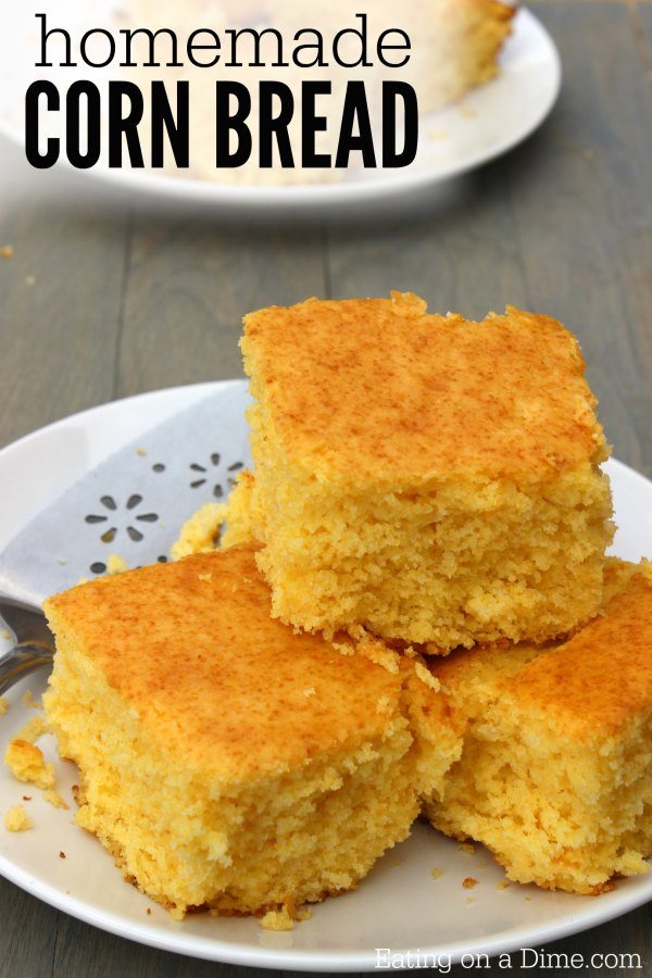 Close up image of cornbread on a white platter. 