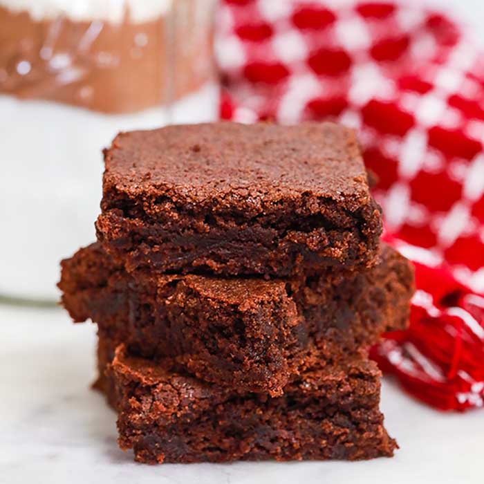 Close up image of brownies stacked. 