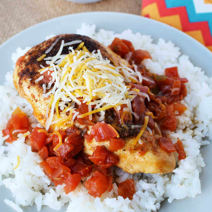 Tex Mex Chicken Skillet Recipe is so easy to make and has tons of southwestern flavor.  Enjoy with rice for a quick meal in 20 minutes your family will love.