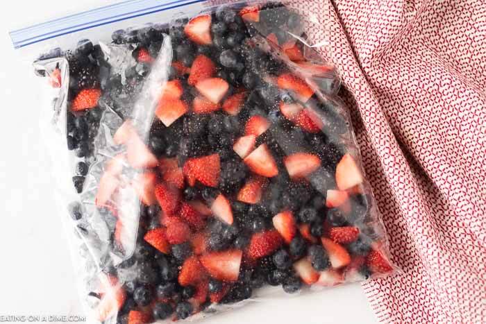 Chopped strawberries, blueberries and blackberries in a ziploc bag