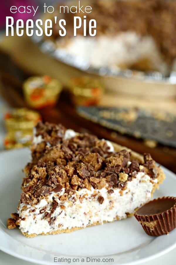 Close up image of a piece of Reese's Candy Peanut Butter pie on a white plate with a Reese's peanut butter cup on the side. 