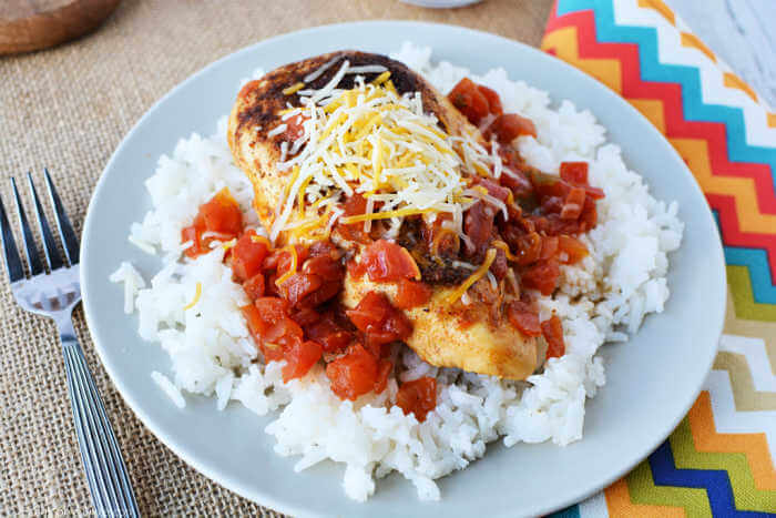 Tex Mex Chicken Skillet Recipe is so easy to make and has tons of southwestern flavor.  Enjoy with rice for a quick meal in 20 minutes your family will love.