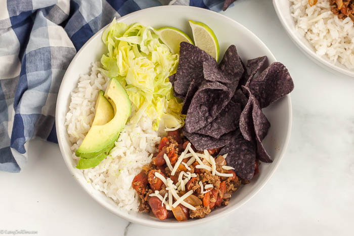 Taco bowl recipe only takes a few easy ingredients and 30 minutes to prepare. Make this taco rice and everyone can choose their favorite toppings!