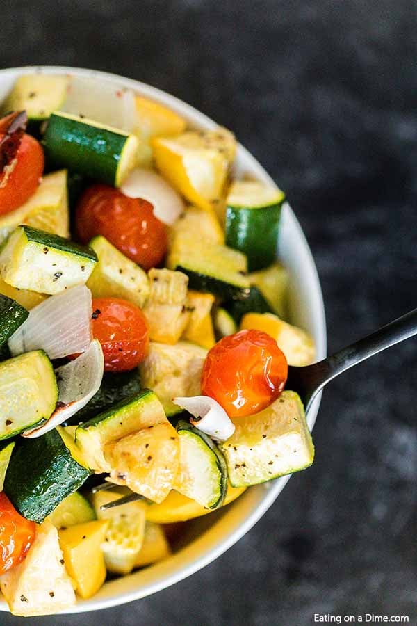 Roasted zucchini and squash recipe is one of our favorite and easiest go to side dish recipes. It is the perfect sheet pan recipe for a delicious side dish.