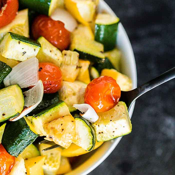 Roasted zucchini and squash recipe is one of our favorite and easiest go to side dish recipes. It is the perfect sheet pan recipe for a delicious side dish.