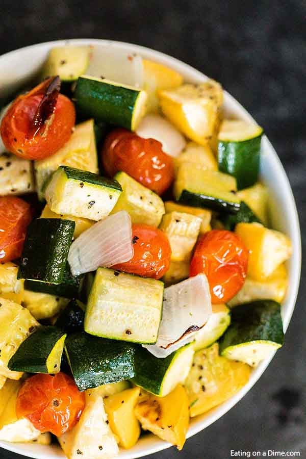 Roasted zucchini and squash recipe is one of our favorite and easiest go to side dish recipes. It is the perfect sheet pan recipe for a delicious side dish.