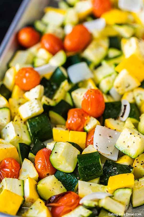 Roasted zucchini and squash recipe is one of our favorite and easiest go to side dish recipes. It is the perfect sheet pan recipe for a delicious side dish.