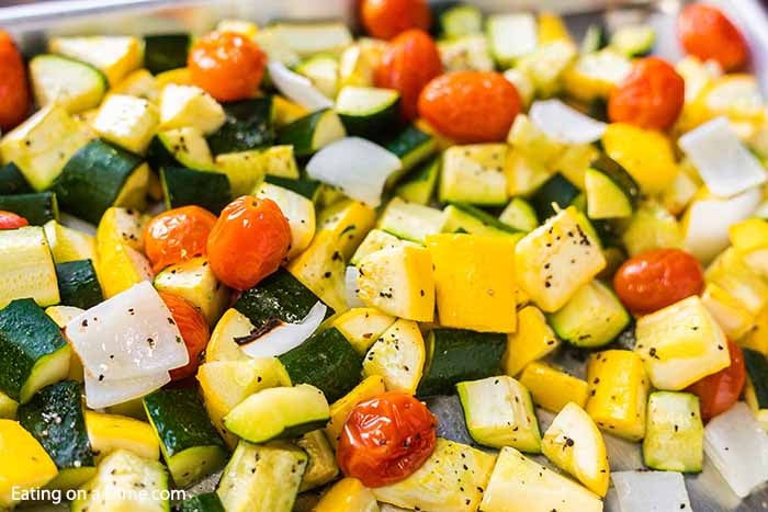 Roasted zucchini and squash recipe is one of our favorite and easiest go to side dish recipes. It is the perfect sheet pan recipe for a delicious side dish.