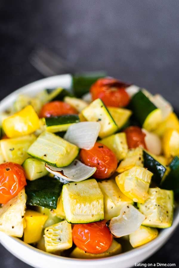 Roasted zucchini and squash recipe is one of our favorite and easiest go to side dish recipes. It is the perfect sheet pan recipe for a delicious side dish.