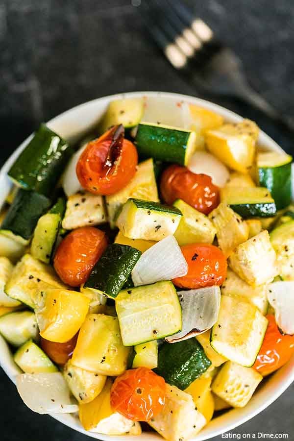 Roasted zucchini and squash recipe is one of our favorite and easiest go to side dish recipes. It is the perfect sheet pan recipe for a delicious side dish.