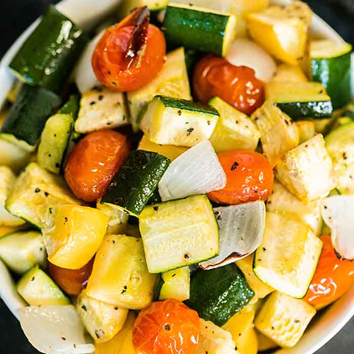 Roasted zucchini and squash recipe is one of our favorite and easiest go to side dish recipes. It is the perfect sheet pan recipe for a delicious side dish.