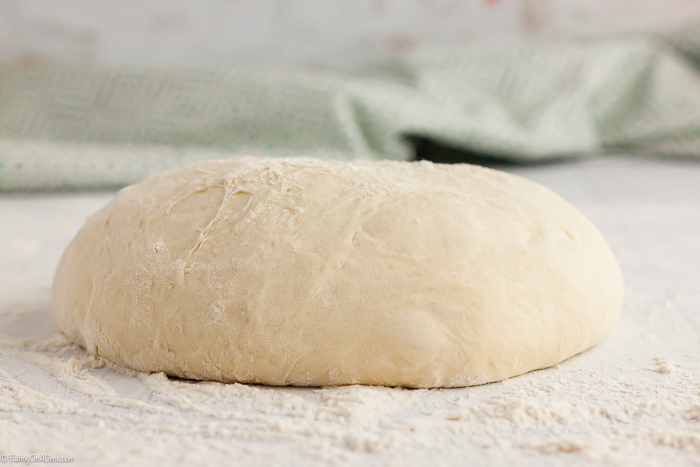 Bread dough on a flour work surface