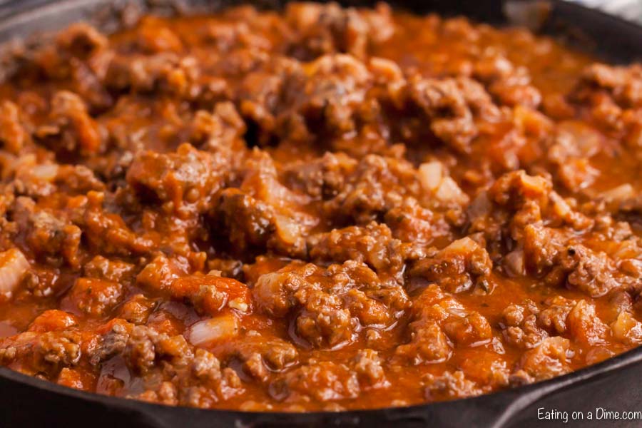 Close up image of meat sauce in a cast iron skillet
