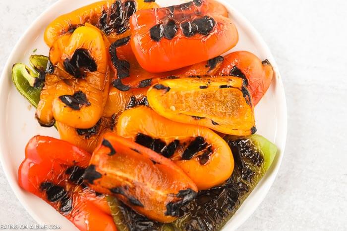 Learn how to grill bell peppers for the perfect side dish for chicken, fish and more. The grill makes this tasty with perfectly crispy edges. 