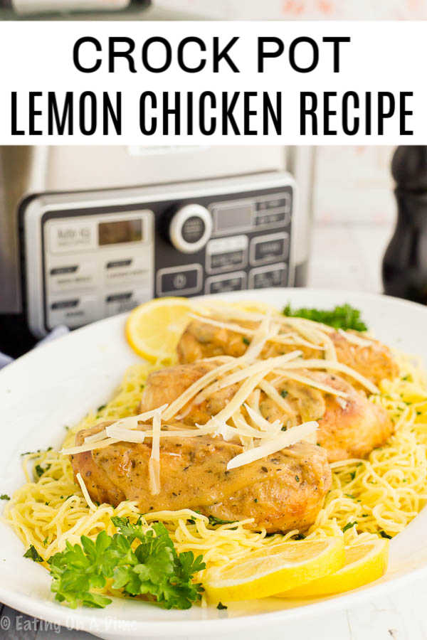 Lemon chicken on spaghetti noodles on a plate