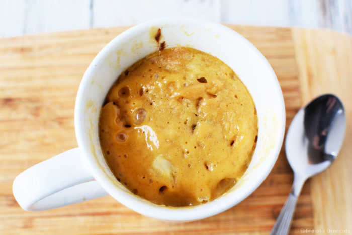 Mug cake in cup ready to eat. 