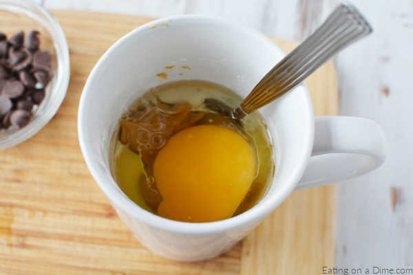 Egg going into the mug. 