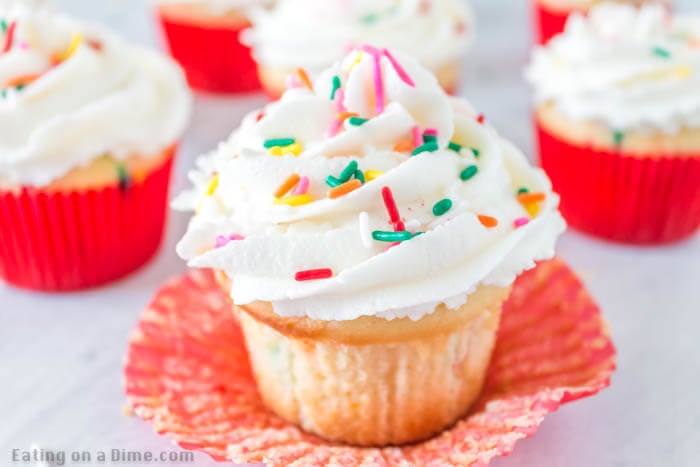 Learn how to make these easy, moist funfetti cupcakes at home with rainbow sprinkles. These easy homemade cupcakes are perfect for any event: Birthday, Christmas or Easter! My kids love funfetti but I can’t always find the cake mix for them, so this is a great option to make homemade, DIY, cute, sprinkle stuffed cupcakes. This is one of my favorite cupcake recipes. This best homemade funfetti cupcake recipe is easy to make and the best home made cupcakes! #eatingonadime #cupcakerecipes #dessertrecipes #funfettidesserts #easyhomemade Learn how to make these easy, moist funfetti cupcakes at home with rainbow sprinkles. These easy homemade cupcakes are perfect for any event: Birthday, Christmas or Easter! My kids love funfetti but I can’t always find the cake mix for them, so this is a great option to make homemade, DIY, cute, sprinkle stuffed cupcakes. This is one of my favorite cupcake recipes. This best homemade funfetti cupcake recipe is easy to make and the best home made cupcakes! #eatingonadime #cupcakerecipes #dessertrecipes #funfettidesserts #easyhomemade