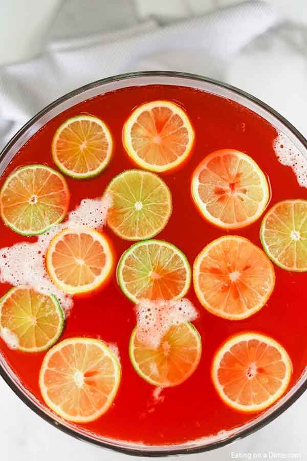 Punch bowl with fruit punch and slice oranges and limes
