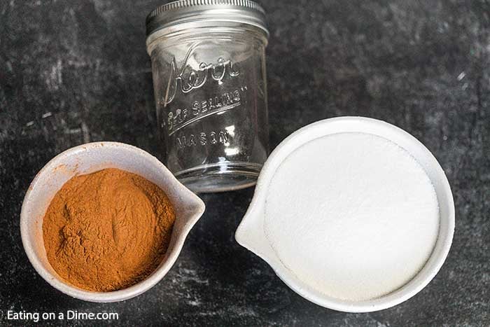 Ingredients to make cinnamon sugar mixture - cinnamon, sugar and a jar to store it in.  