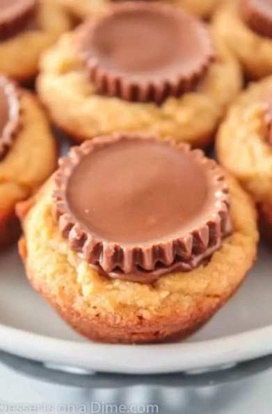 Close up photo of Reese's peanut butter cup cookies on a white plate.