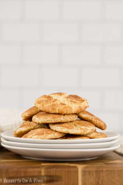 Picture of Snickerdoodle Cookie Recipe piled on stack of white plates.