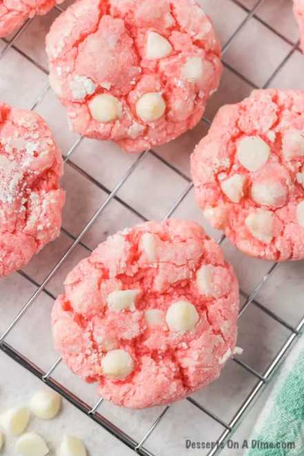 Closeup of strawberry cheesecake cookies on wire rack.