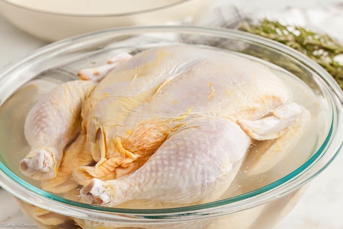 Brining the chicken in a large bowl