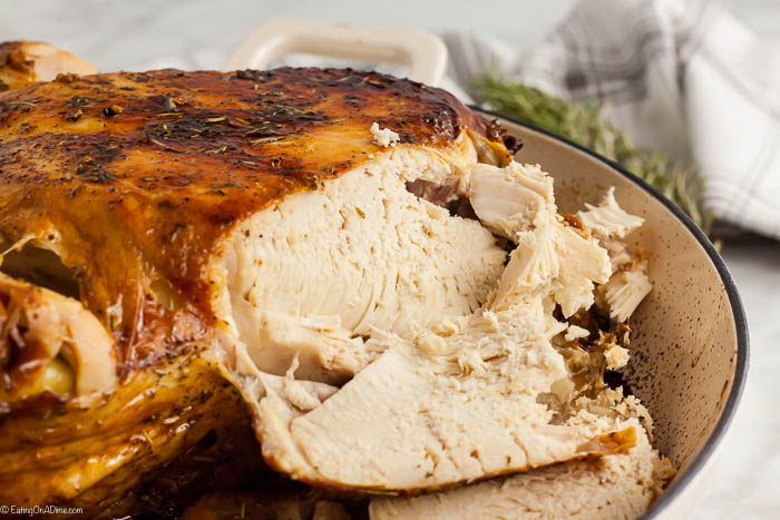 Roasted chicken in a large pot sliced