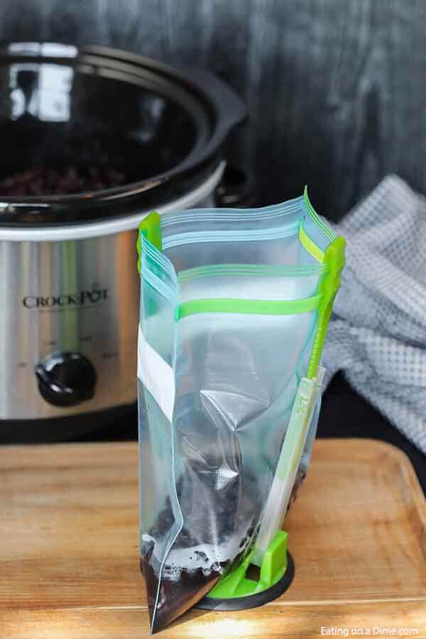 Save money and learn how to cook black beans in the crock pot. It is super easy and takes hardly any effort.