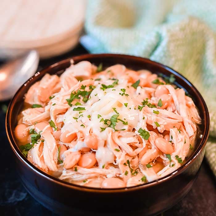 Crockpot White Chicken Chili is a family favorite around here and so easy to prepare. You can make this meal for under $5 making this a frugal meal idea. 