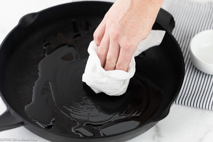wipe out excess oil in cast iron