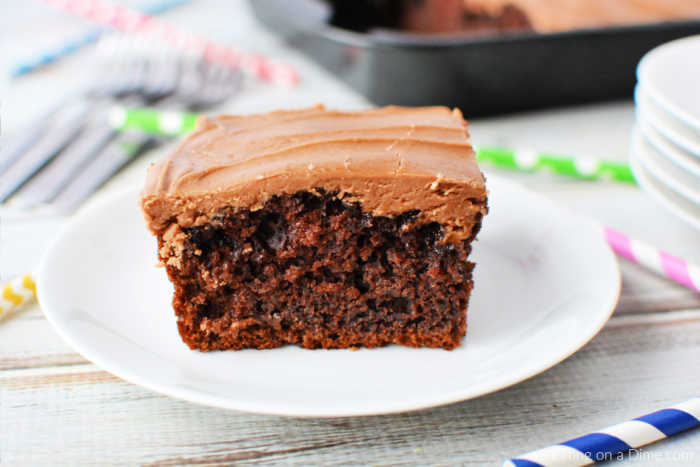 A serving of chocolate cola cake on a white plate