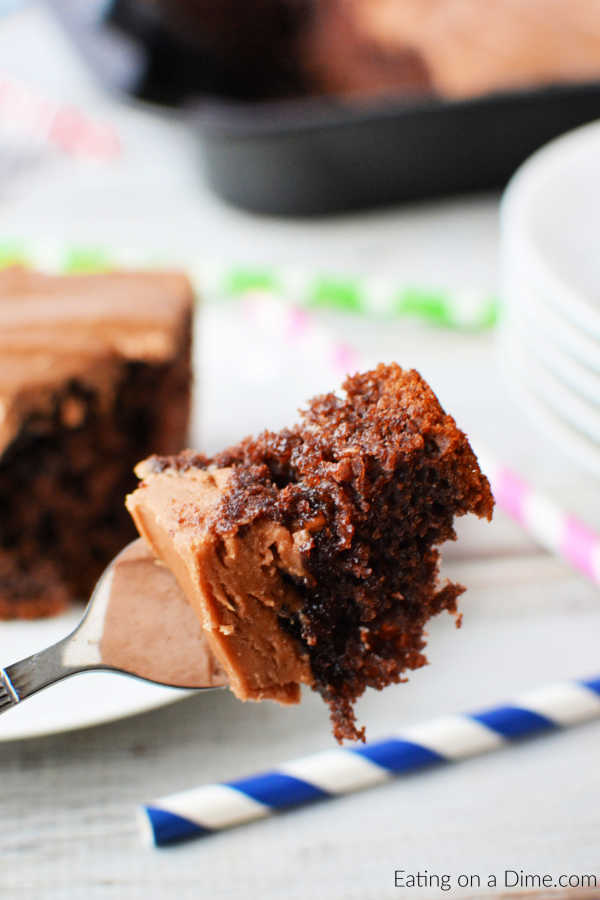 A bite of chocolate cola cake on a fork