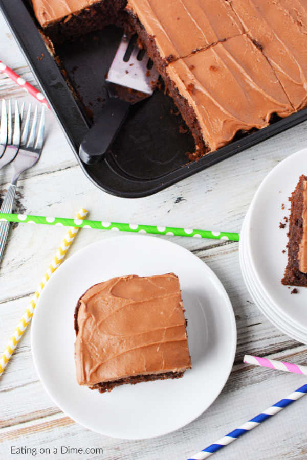 A serving of chocolate cola cake on a white plate