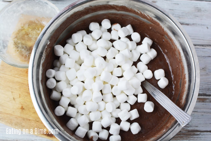 Adding the marshmallows in a cake mixture