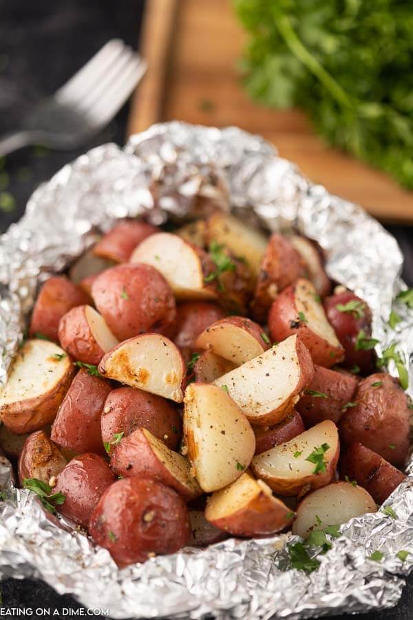 Foil pack grilled red potatoes help to make dinner a breeze without any cleanup. This is the perfect side dish for the grill or the oven. 