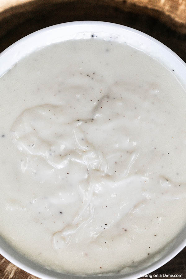 Learn how to make this easy homemade White Gravy Recipe in just a few minutes and with simple pantry ingredients. Save money by making your own white gravy! This southern white gravy recipe is the best for my favorite Southern recipes like biscuits and gravy for breakfast or chicken fried steak for dinner! #eatingonadime #gravyrecipe #easyrecipes