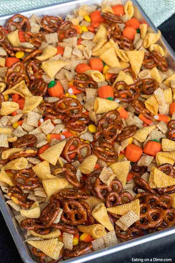 Halloween chex mix on a baking sheet