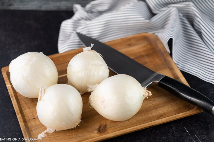 Overview of Onions on a Cutting Board with a knife