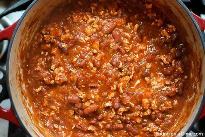 Close up image of ground turkey chili in a large pot. 