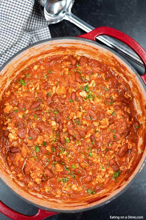 Close up image of turkey chili in a large pot. 