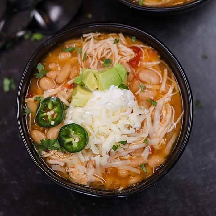 Crock pot white chicken taco chili recipe is delicious on a cold day. It is super easy and kid approved. You can add your favorite toppings!