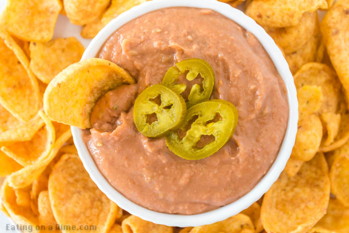 Learn how to make Fritos bean dip at home for a fraction of the cost of store bought. This is the best dip for parties, movie night or Game Day!
