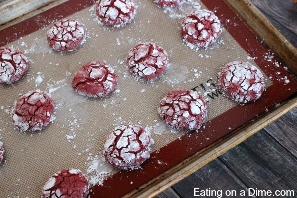 Close up image of Red Velvet Cake Mix Cookies on a baking sheet. 