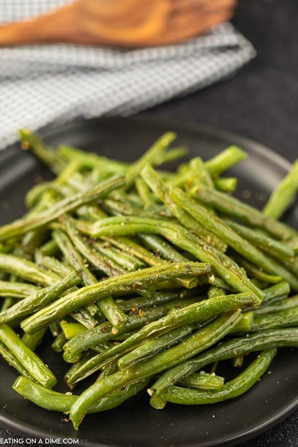 Oven roasted green beans make the best side dish in minutes and only require a few ingredients. Serve it with dinner for a tasty meal. 