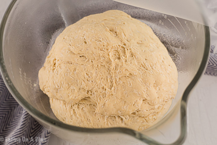 close up image of pretzel dough in a bowl. 