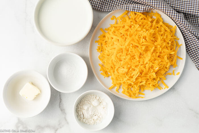 ingredients for recipe: milk, butter, shredded cheese, flour.